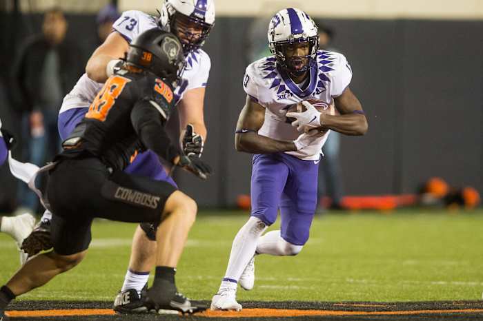 Nov 13, 2021; Stillwater, Oklahoma, USA; TCU Horned Frogs running back Ahmonte Watkins (19) runs the ball during the fourth quarter against the Oklahoma State Cowboys at Boone Pickens Stadium. Mandatory Credit: Brett Rojo-USA TODAY Sports